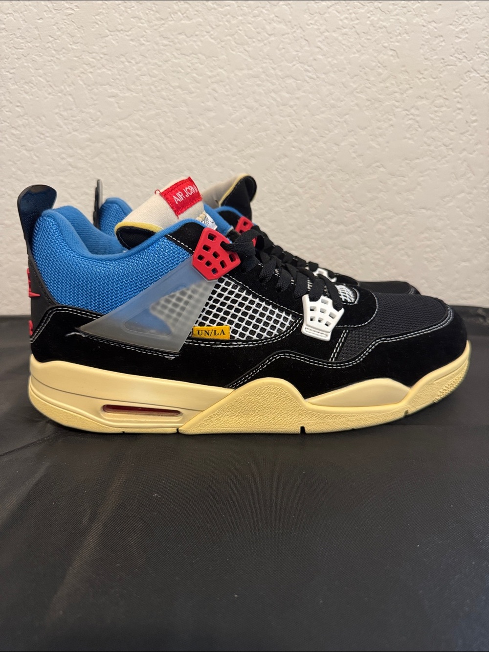Nike Air Jordan 4 Retro UN/LA - Black/Blue/Red/Cream